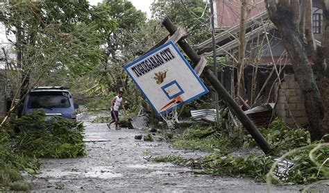 Typhoon Mangkhut, aka Ompong, slams the Philippines .